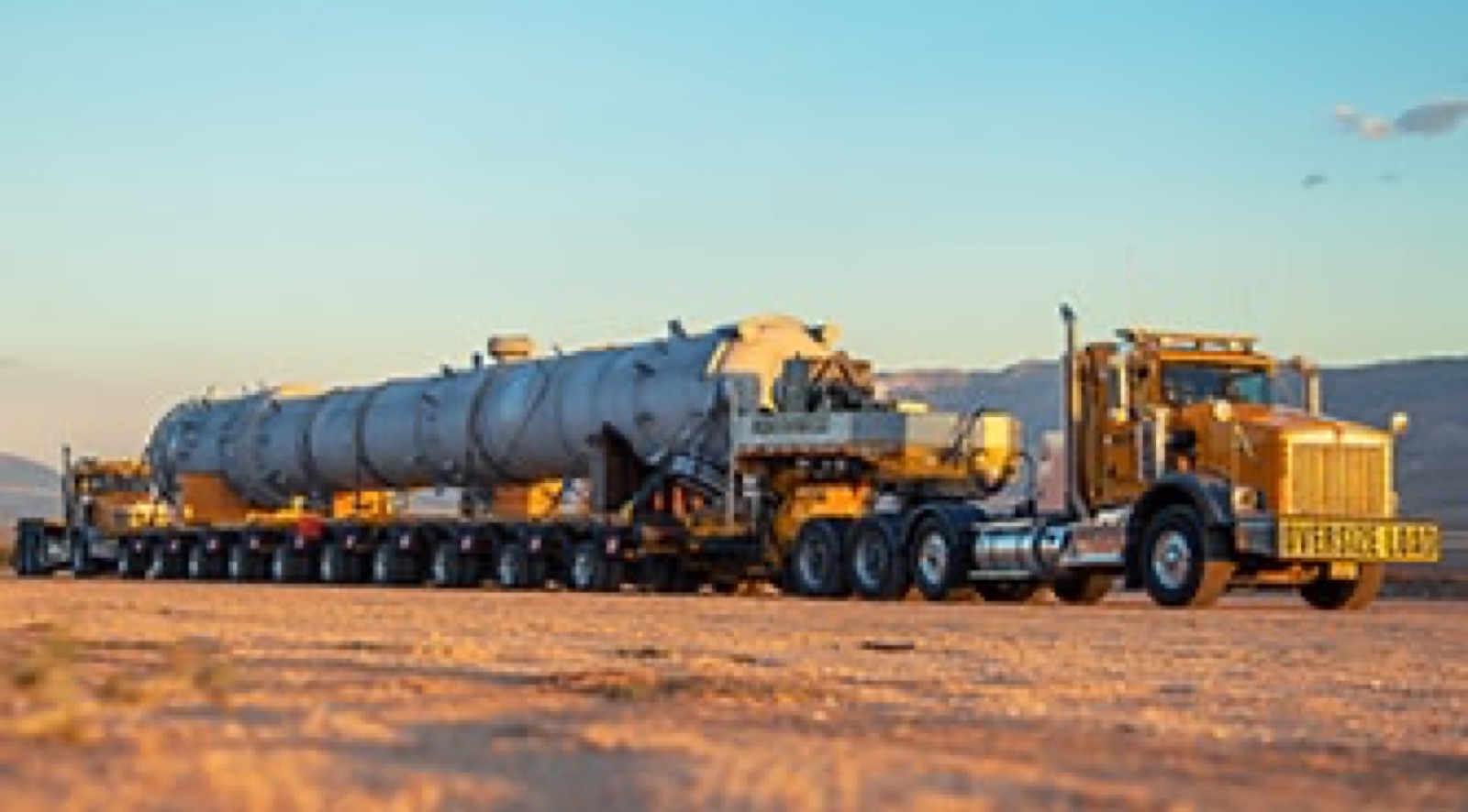 Northwest heavy haul tractor pulling an oversize vessel
