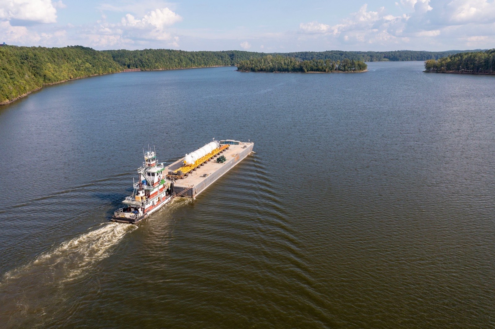 Northwest dual-lane transporter moving a massive vessel down the highway