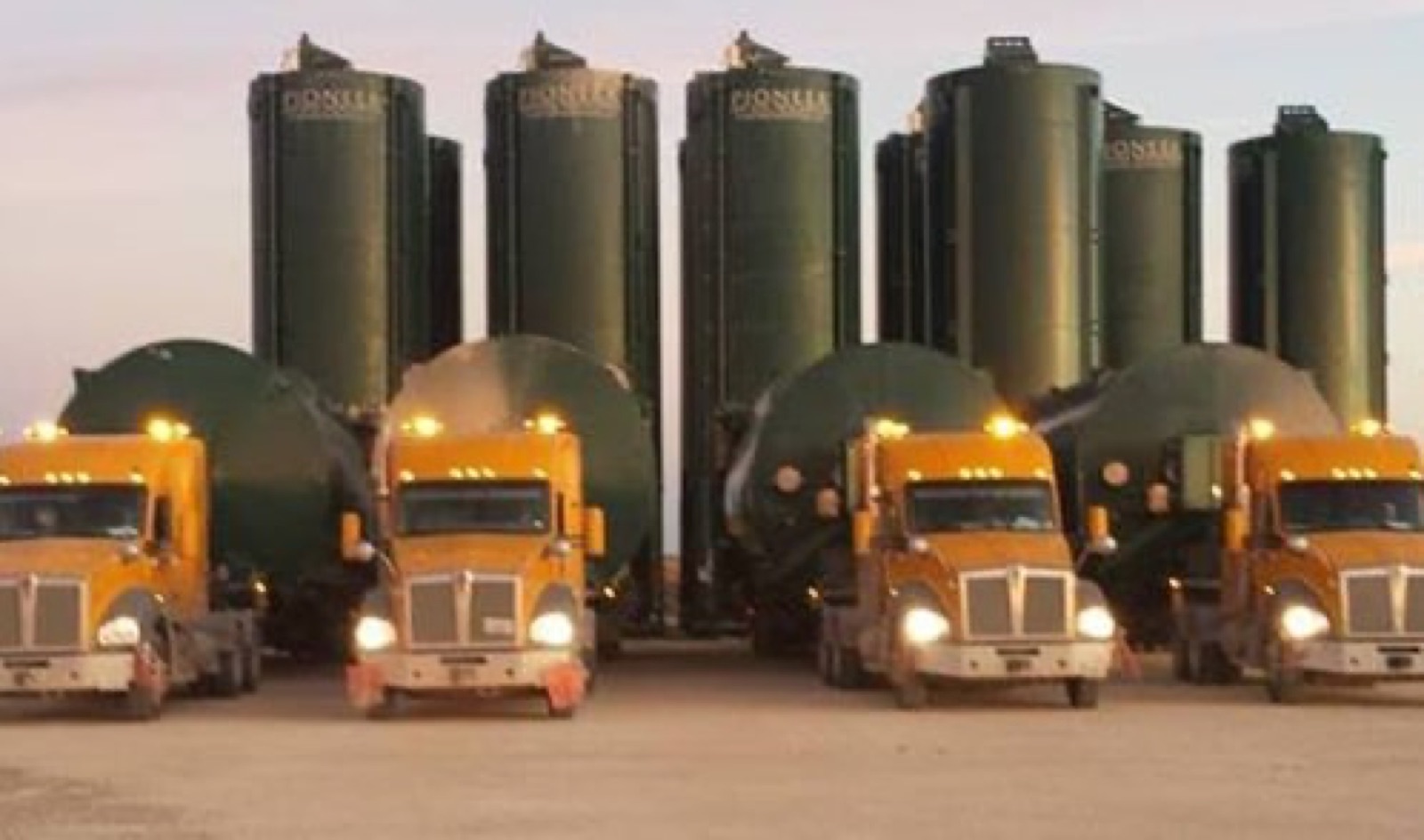 Temporary silos staged at a well site