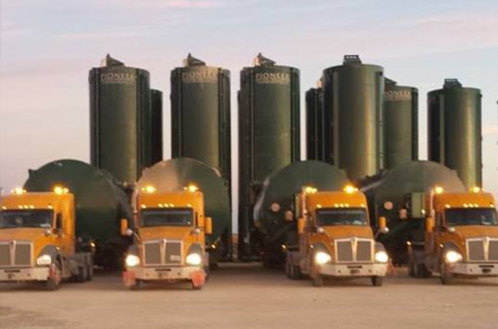 Transloading silos and pneumatic trucks
