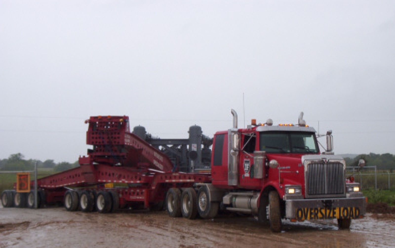 Two Liebherr LTM 1220 cranes making a tandem lift of a gas compressor