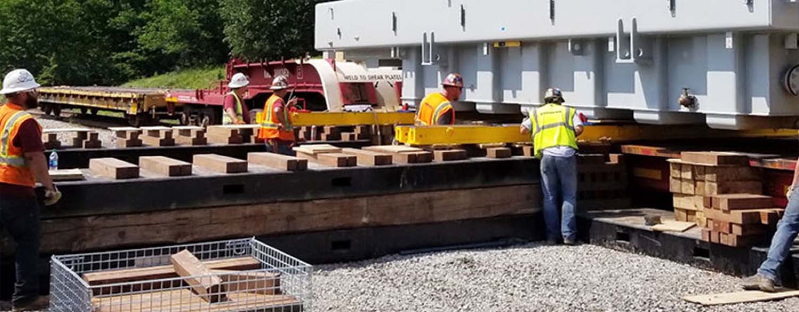 Jack and slide system moving heavy equipment inside a plant
